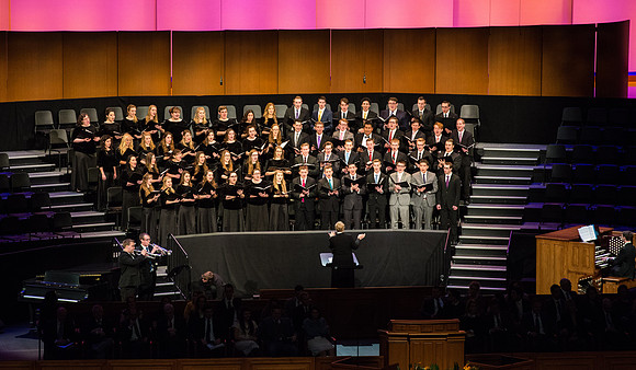A choir performs at Devotional.