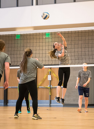 Students play volleyball in class in the BYU-Idaho Center.