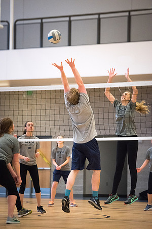 Students play volleyball in class in the BYU-Idaho Center.