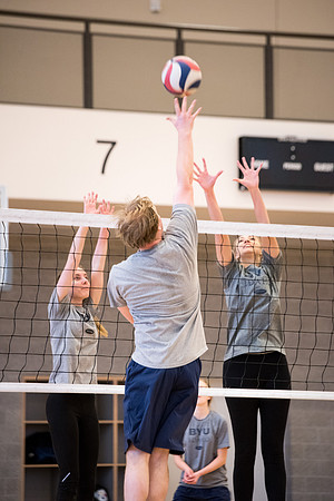 Students play volleyball in class in the BYU-Idaho Center.