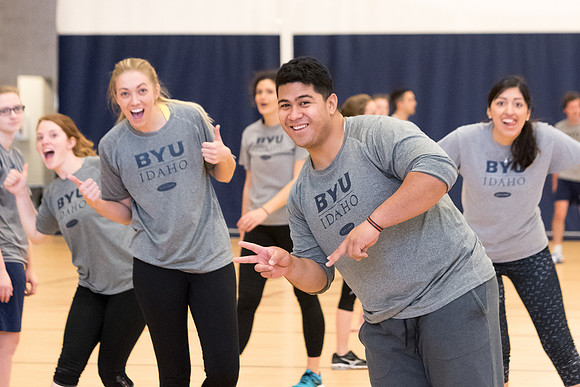 Students play volleyball in class in the BYU-Idaho Center.