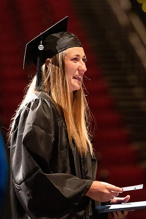 Graduates walk across the stage at the BYU-Idaho Center as they accept their diplomas for Agriculture and Life Science.