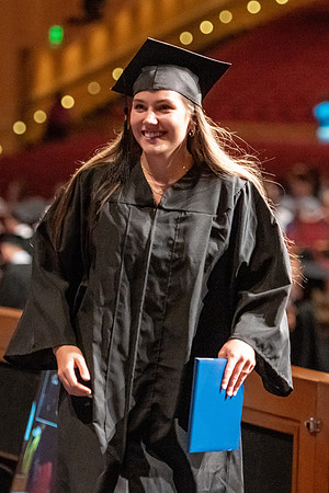 Graduates walk across the stage at the BYU-Idaho Center as they accept their diplomas for Agriculture and Life Science.