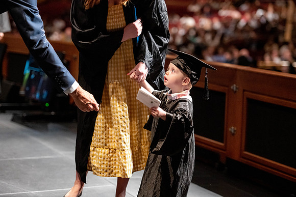 Graduates walk across the stage at the BYU-Idaho Center as they accept their diplomas for Agriculture and Life Science.