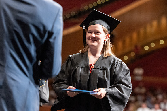 Graduates walk across the stage at the BYU-Idaho Center as they accept their diplomas for Agriculture and Life Science.