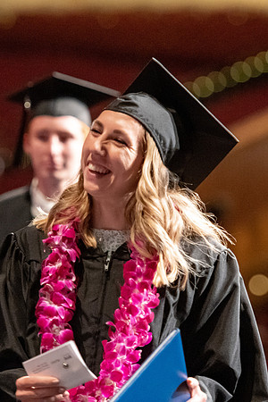 Graduates walk across the stage at the BYU-Idaho Center as they accept their diplomas for Agriculture and Life Science.