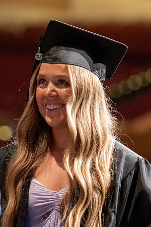 Graduates walk across the stage at the BYU-Idaho Center as they accept their diplomas for Agriculture and Life Science.
