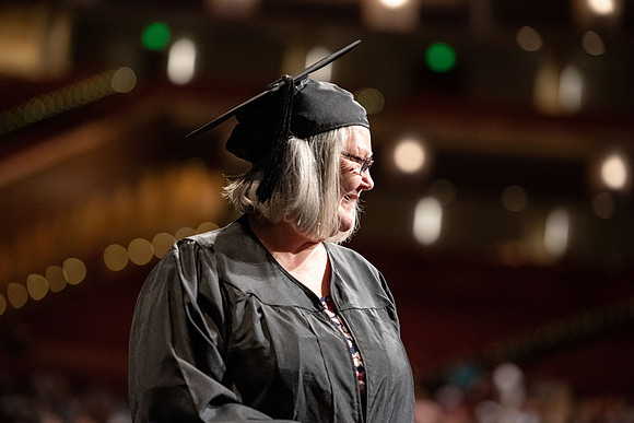 Graduates walk across the stage at the BYU-Idaho Center as they accept their diplomas for Agriculture and Life Science.