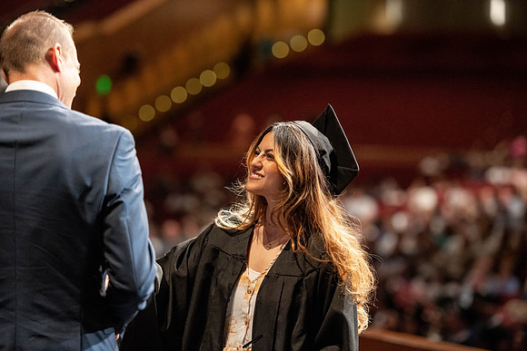 Graduates walk across the stage at the BYU-Idaho Center as they accept their diplomas for Agriculture and Life Science.