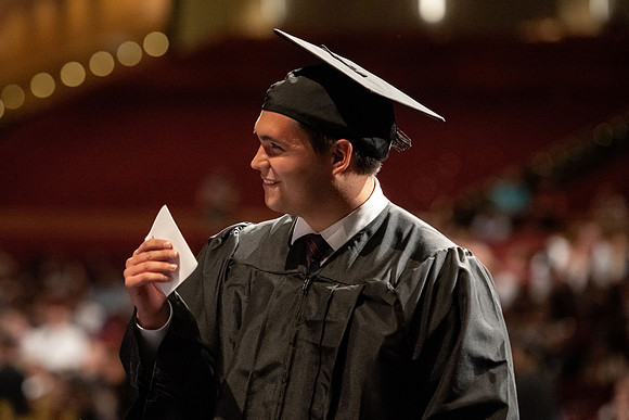 Graduates walk across the stage at the BYU-Idaho Center as they accept their diplomas for Agriculture and Life Science.