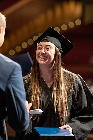 Graduates walk across the stage at the BYU-Idaho Center as they accept their diplomas for Agriculture and Life Science.