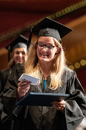 Graduates walk across the stage at the BYU-Idaho Center as they accept their diplomas for Agriculture and Life Science.