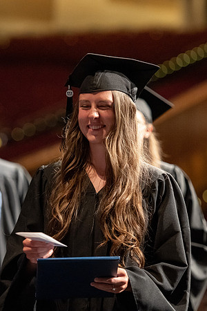 Graduates walk across the stage at the BYU-Idaho Center as they accept their diplomas for Agriculture and Life Science.