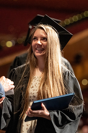 Graduates walk across the stage at the BYU-Idaho Center as they accept their diplomas for Agriculture and Life Science.