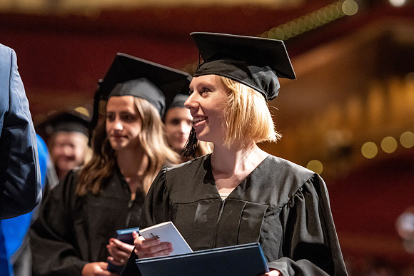 Graduates walk across the stage at the BYU-Idaho Center as they accept their diplomas for Agriculture and Life Science.