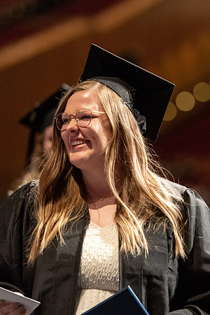 Graduates walk across the stage at the BYU-Idaho Center as they accept their diplomas for Agriculture and Life Science.