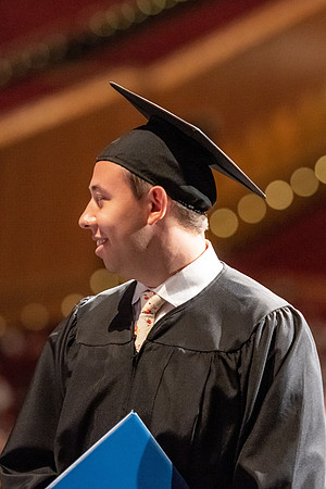 Graduates walk across the stage at the BYU-Idaho Center as they accept their diplomas for Agriculture and Life Science.