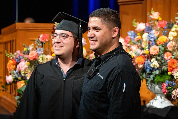 Graduates walk across the stage at the BYU-Idaho Center as they accept their diplomas for Agriculture and Life Science.