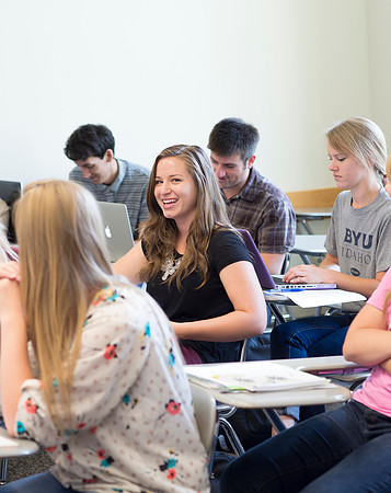 Sister Brooke McKenna teaches students in a communication class.
