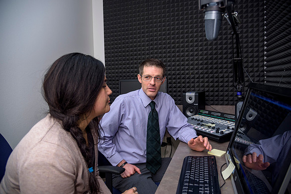Students and staff working in the radio broadcasting center.