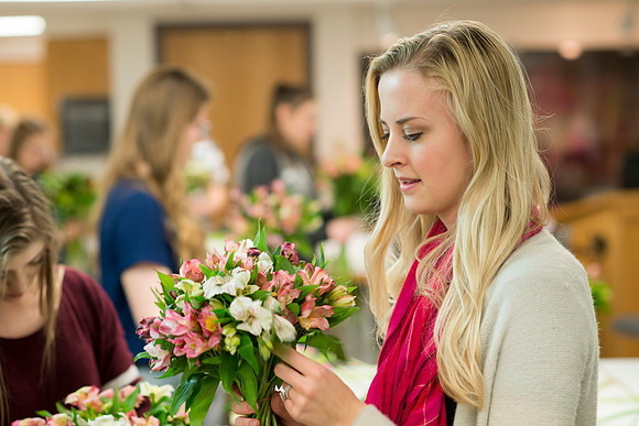 Students in Ben Romney's Floral Design class practice making bouquets.