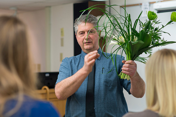 Students in Ben Romney's Floral Design class practice making bouquets.