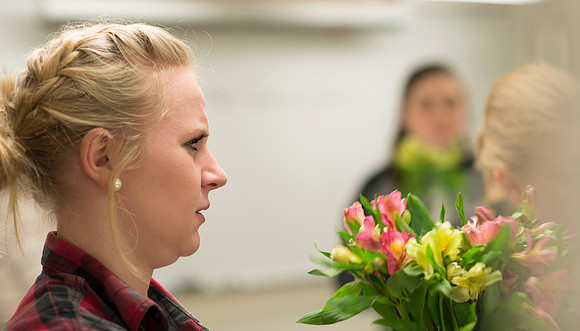 Students in Ben Romney's Floral Design class practice making bouquets.