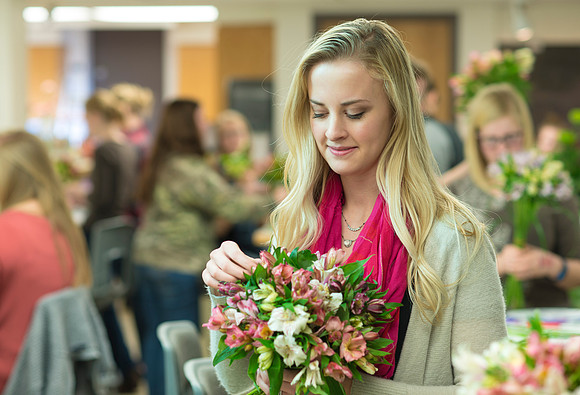 Students in Ben Romney's Floral Design class practice making bouquets.