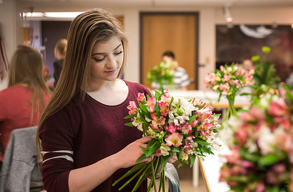 Students in Ben Romney's Floral Design class practice making bouquets.