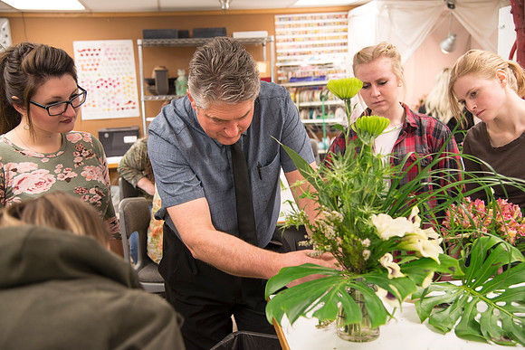 Students in Ben Romney's Floral Design class practice making bouquets.