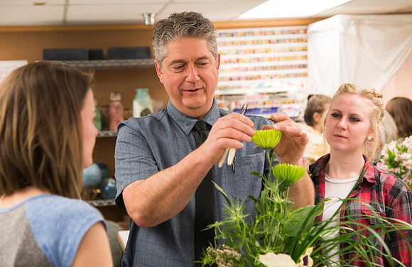 Students in Ben Romney's Floral Design class practice making bouquets.