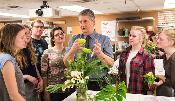 Students in Ben Romney's Floral Design class practice making bouquets.