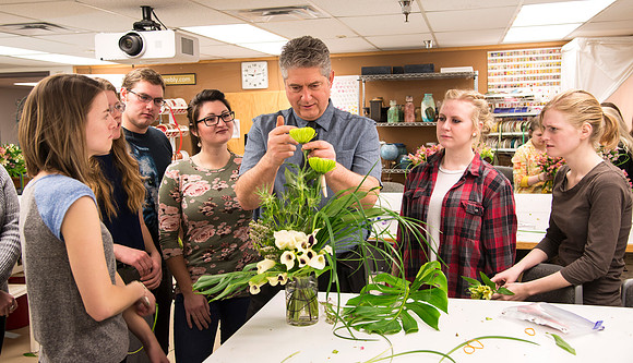 Students in Ben Romney's Floral Design class practice making bouquets.