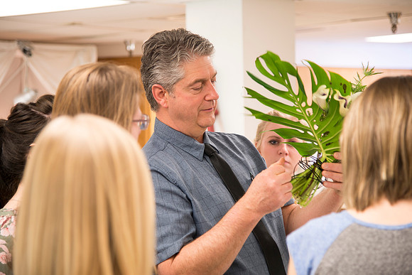 Students in Ben Romney's Floral Design class practice making bouquets.