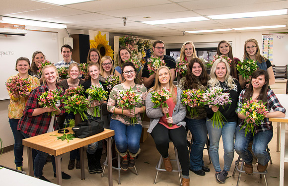 Students in Ben Romney's Floral Design class practice making bouquets.