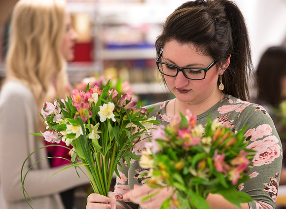 Students in Ben Romney's Floral Design class practice making bouquets.
