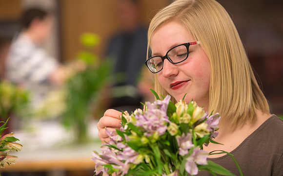 Students in Ben Romney's Floral Design class practice making bouquets.