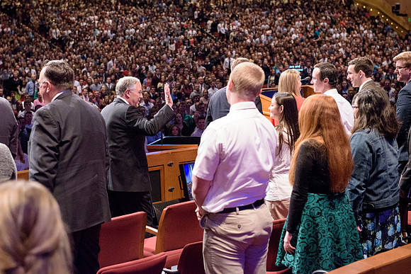 Elder Neil L. Andersen, waves to students at BYU-Idaho's devotional. Photo by Ryan Chase.