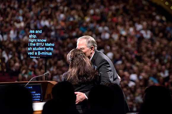 Elder Neil L. Andersen, kisses his wife wile speaking at BYU-Idaho's devotional. Photo by Ryan Chase.