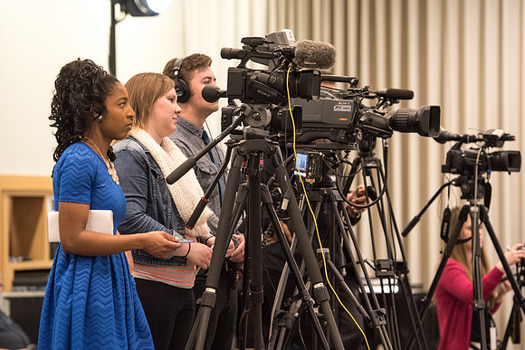 President Clark G. Gilbert and President Henry J. Eyring answer questions at a press conference.