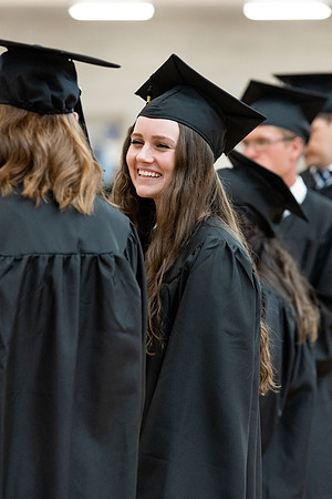 Graduates around campus.