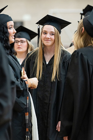 Graduates around campus.
