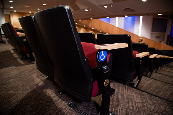 Ushers perform their duties in the I-Center to prepare for devotional. Used for an usher training video.