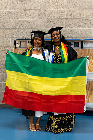 Students before commencement, talking with family and friends.
