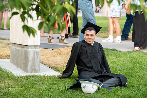 Students after commencement, talking with family and friends.