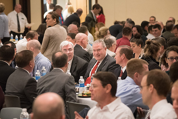 Faculty enjoy a luncheon with Clayton Christensen, the Kim B. Clark Professor of Business Administration at the Harvard Business School