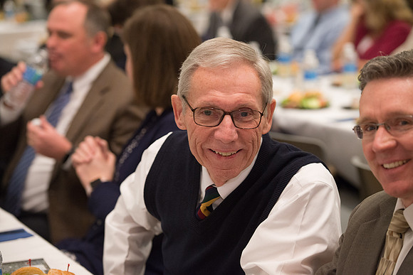 Faculty gather at a luncheon to be taught by Clayton Christensen, the "Kim B. Clark Professor" of Business Administration at the Harvard Business School.