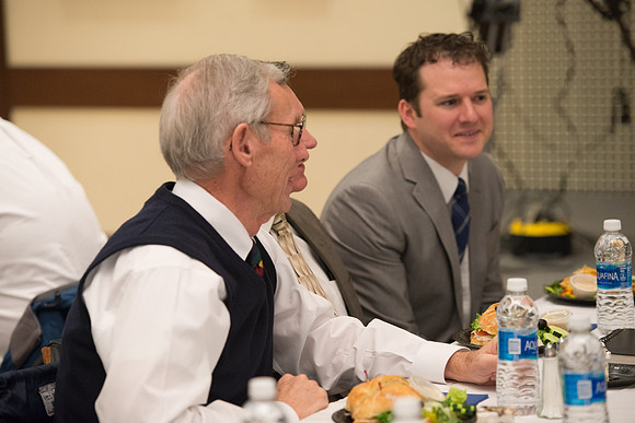 Faculty gather at a luncheon to be taught by Clayton Christensen, the "Kim B. Clark Professor" of Business Administration at the Harvard Business School.