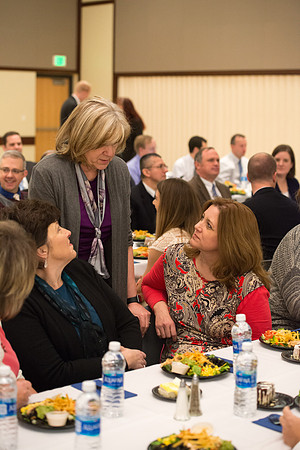 Faculty gather at a luncheon to be taught by Clayton Christensen, the "Kim B. Clark Professor" of Business Administration at the Harvard Business School.