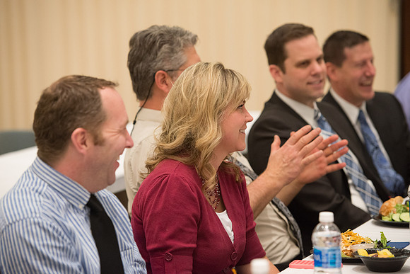Faculty gather at a luncheon to be taught by Clayton Christensen, the "Kim B. Clark Professor" of Business Administration at the Harvard Business School.